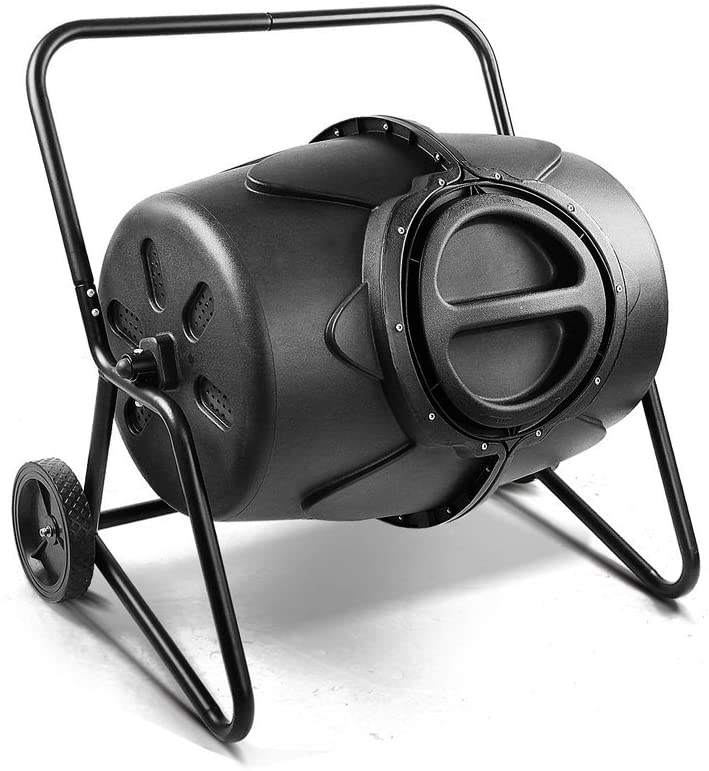Person adding kitchen waste into a Removable Rotary Compost Bucket for efficient composting in a garden.